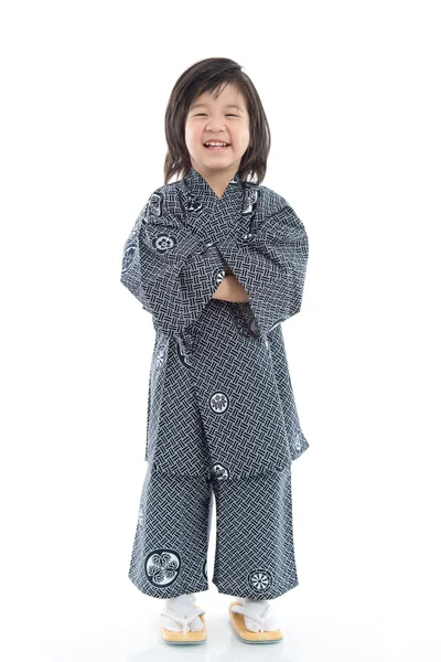 Feliz asiático chico en kimono sentado en blanco fondo —  Fotos de Stock