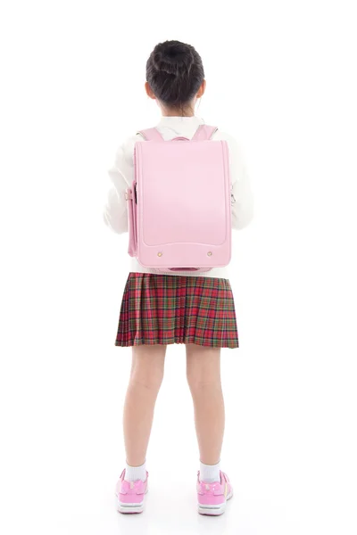 Asijské dítě ve školní uniformě s školní tašku na bílém poza — Stock fotografie