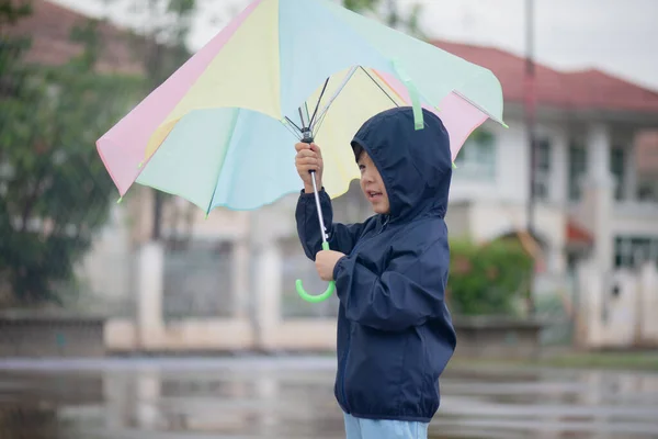 Happy Asian Boy Holding Colorful Umbrella Playing Park Rain — Stock Photo, Image