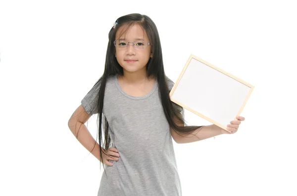 Little Asian girl holding empty whiteboard — Stock Photo, Image