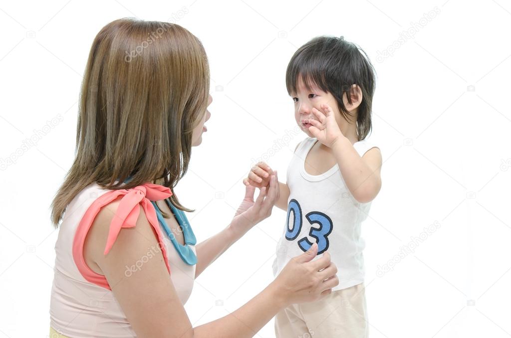 Mother and asian baby crying