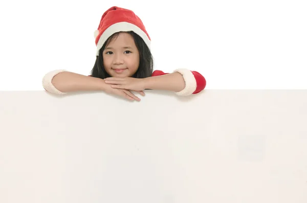 ホワイト ボードでサンタ衣装で美しいアジアの少女 — ストック写真