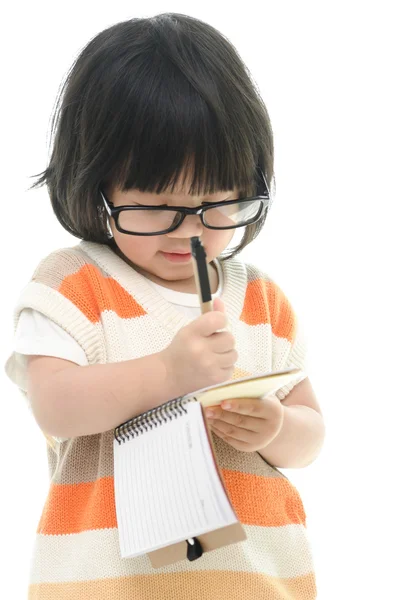 Asiatiska baby står och skriva — Stockfoto