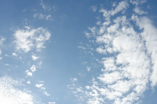 White clouds in a blue sky Stock Image