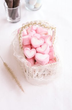 Pink heart marshmallow in Vintage basket  clipart
