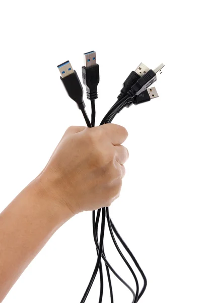 Mão segurando muitos cabo USB — Fotografia de Stock