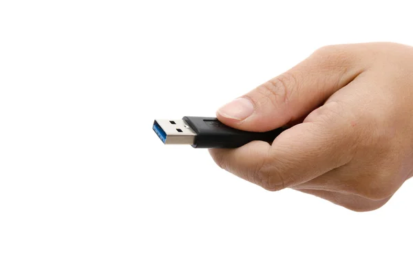Mão segurando armazenamento de dados USB preto — Fotografia de Stock