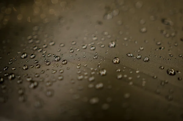 Gotas de água no fundo guarda-chuva — Fotografia de Stock