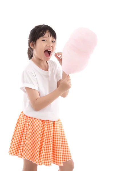 Cute asian girl holding pink cotton candy — Stock Photo, Image