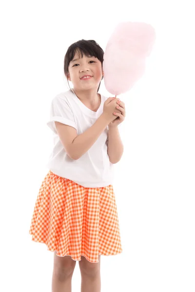 Cute asian girl holding pink cotton candy — Stock Photo, Image