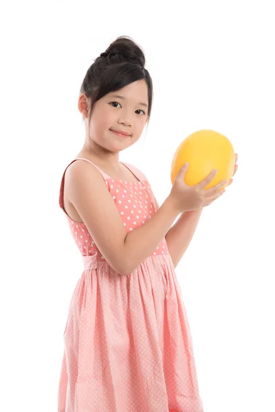 Little asian girl holding melon — Stok fotoğraf