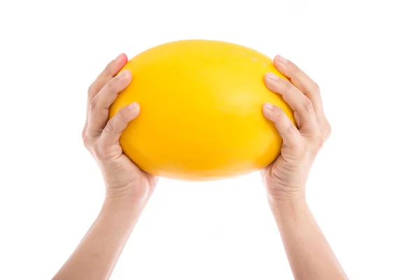 Female's hand holding honeydew melon — Stock Photo, Image