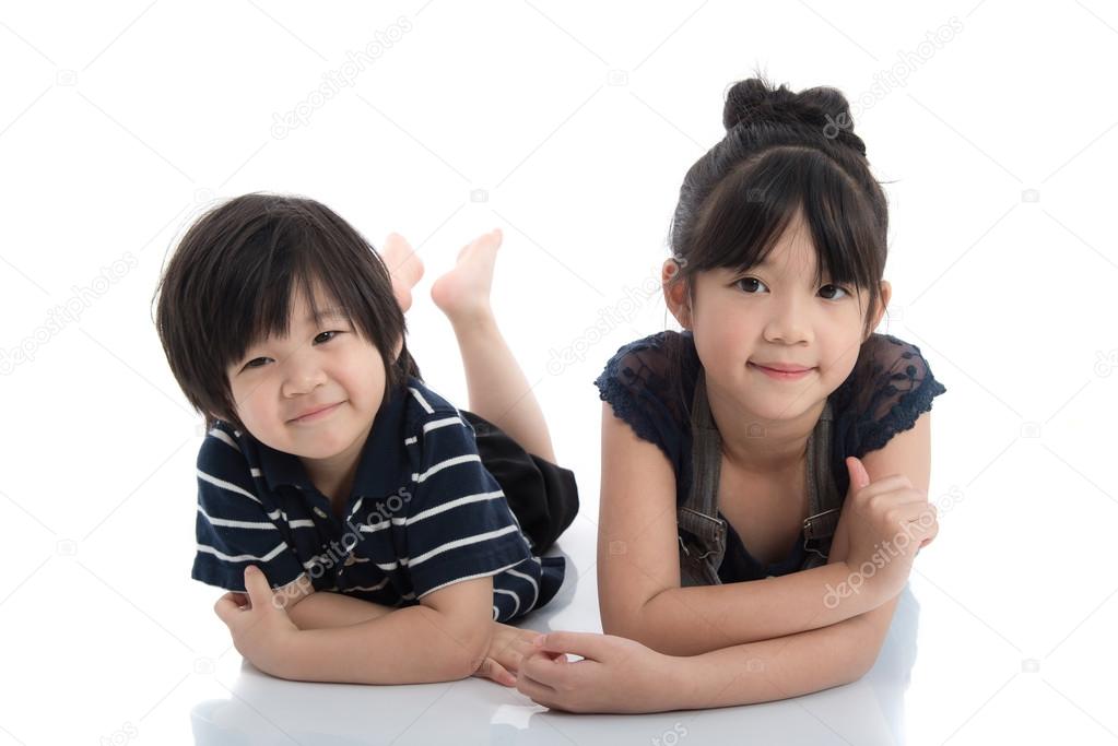 Asian children lying on the floor