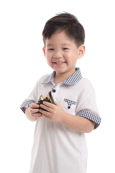 Cute asian child eating rice ball or onigiri — Stock Photo, Image