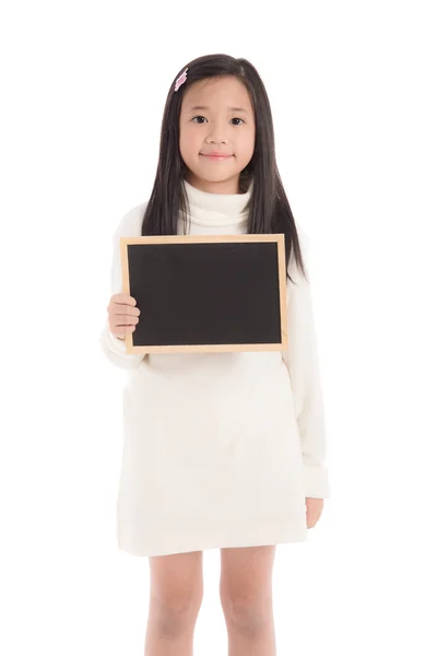 Cute asian girl in white turtleneck dress holding blackboard — Stock Photo, Image