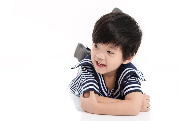 Cute asian boy lying on white background isolated — Stock Photo, Image