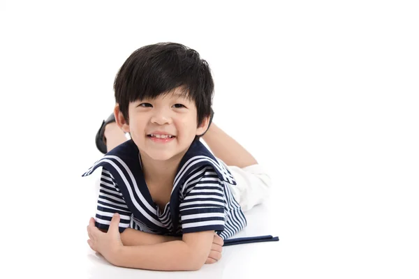 Cute asian boy lying on white background isolated — Stock Photo, Image