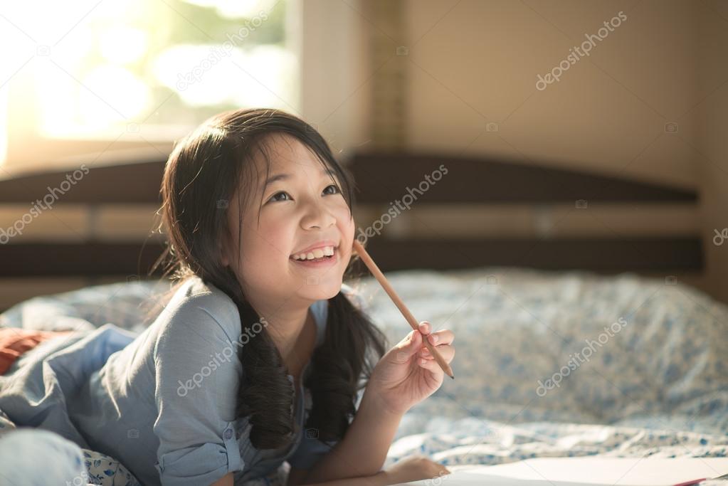 Beautiful asian girl thinking