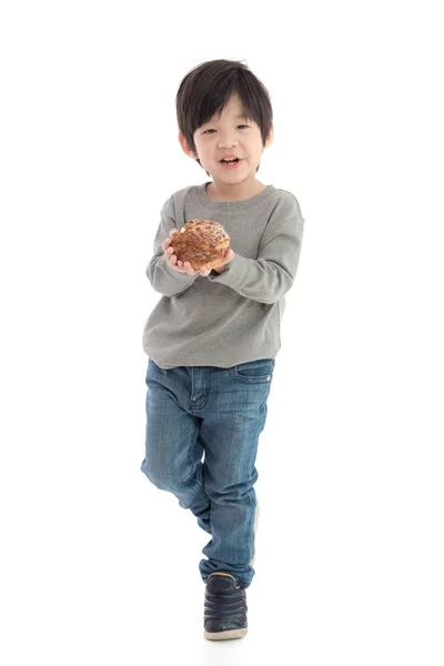 Bonito ásia menino comer creme sopro — Fotografia de Stock