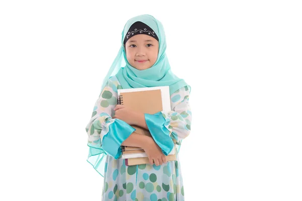 Asiatiska muslimska student anläggning böcker — Stockfoto