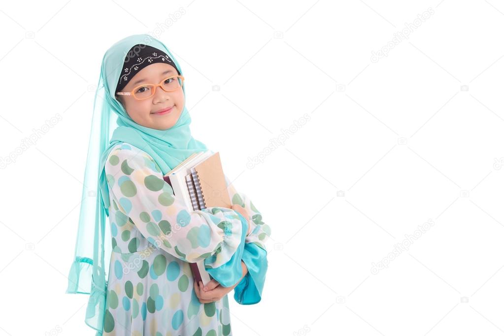 Asian muslim student holding books