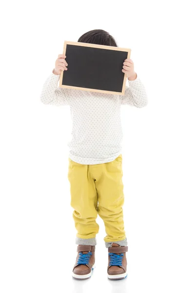 Asian boy holding black board on white background isolated — Stock Photo, Image