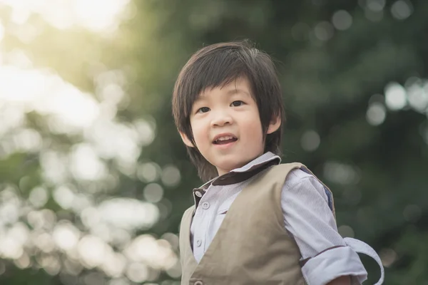 Close up of happy asian child outdoor — Stock Photo, Image