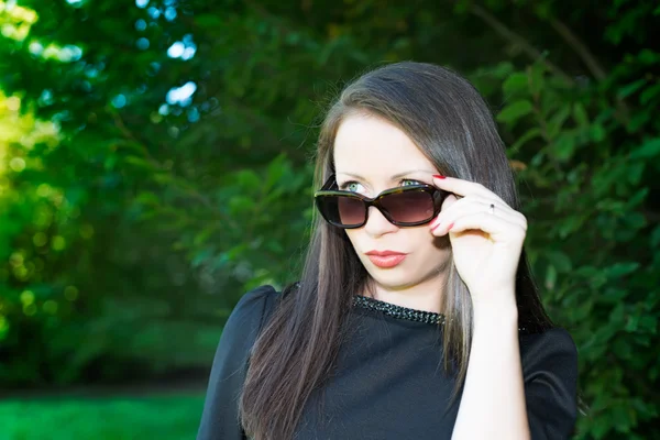 Portrait of young attractive girl with sunglasses — Stock Photo, Image