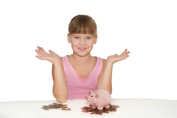 Ragazza con salvadanaio mostrando spazio copia — Foto Stock