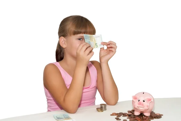 Niña con dinero en las manos aislada —  Fotos de Stock