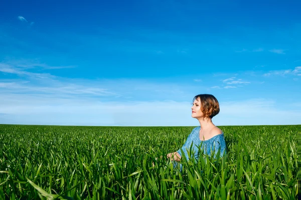 Woman enjoying in green field Royalty Free Stock Images