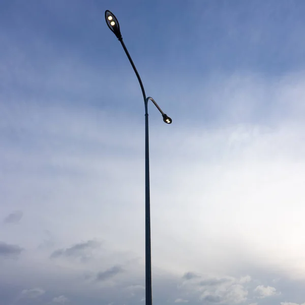 LED lighting of street lamps against the blue sky. Cover. Web banner