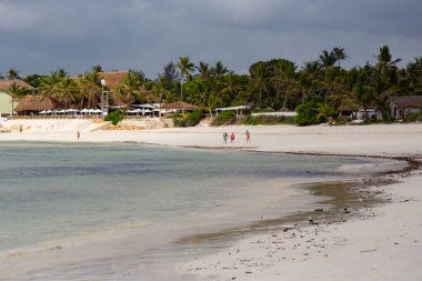 WATAMU, KENYA - December 2020: Watamu Blue Bay beach, white sandy beach, hotels, boats and people on the beach, Watamu, Kenya