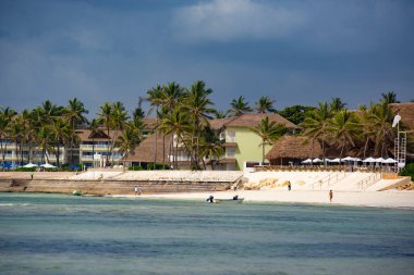 WATAMU, KENYA - December 2020: Watamu Blue Bay beach, white sandy beach, hotels, boats and people on the beach, Watamu, Kenya