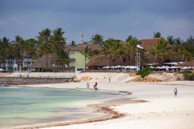 WATAMU, KENYA - December 2020: Watamu Blue Bay beach, white sandy beach, hotels, boats and people on the beach, Watamu, Kenya