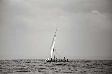 WATAMU, KENYA - January 2021: African fishermen catching fish from the boat in Watamu bay, Kenya