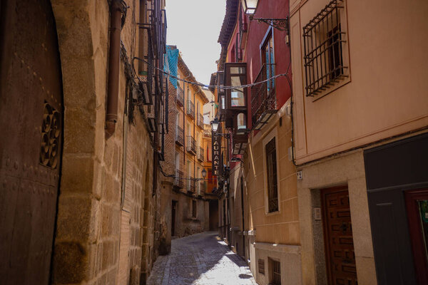TOLEDO, SPAIN - June 2019: Historical architecture in Toledo town, narrow street in old town Toledo, Spain