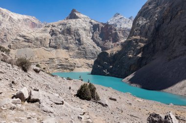 Big Allo lake view with mountain range and turquoise water in Fann mountains Pamir Alay Tajikistan
