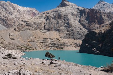 Big Allo lake view with mountain range and turquoise water in Fann mountains Pamir Alay Tajikistan