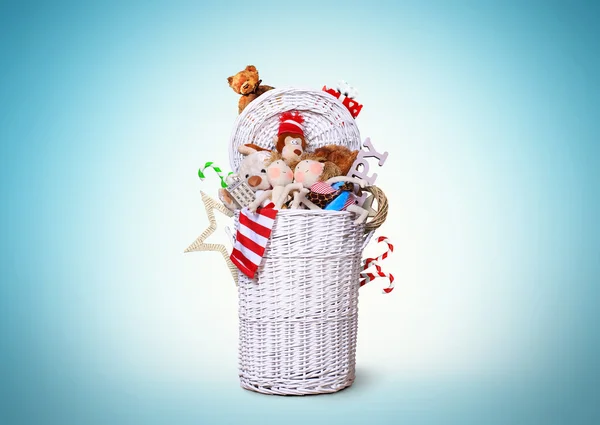 White wicker basket full of toys — Stock Photo, Image