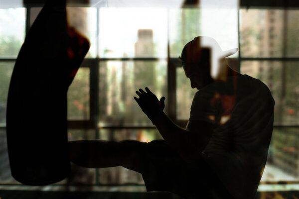 Men hits a punching bag