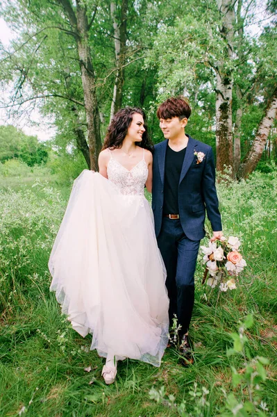 Smiling Newlyweds Walking Having Fun Fresh Green Forest Portrait Bride — Stock Photo, Image