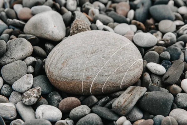 Gravel pattern of colored stones. Abstract nature pebbles background. Stone background. Sea peblles beach.