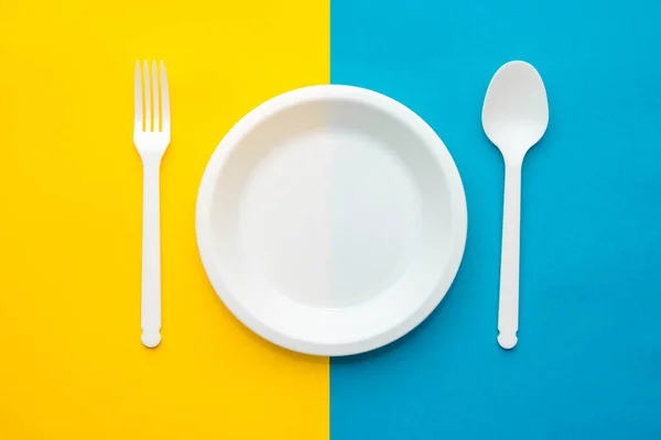 Plastic White Fork Spoon Plate Yellow Blue Background Cooking Utensil — Stock Photo, Image