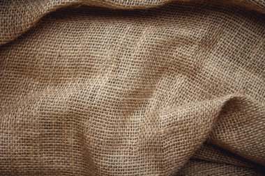 Arkaplan görüntüsü olarak çuval kahverengisi. Üst görünüm, alanı kopyala.