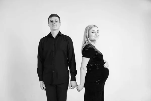 Pregnant Woman Her Husband Holding Hands Black Clothes White Background — Stock Photo, Image