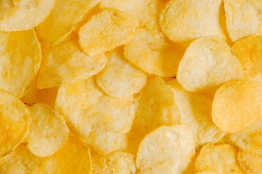 Patates cipsi arka plan görüntü dokusu olarak atıştırmalık. Üst Manzara. Kopyala, metin için boşluk.