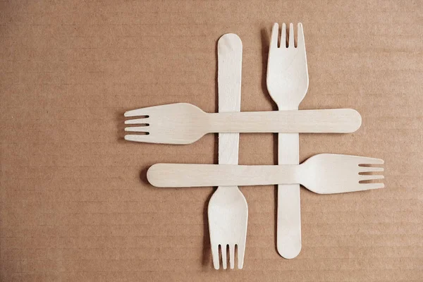 Wooden Forks Cardboard Background Eco Friendly Disposable Tableware Top View — Stock Photo, Image