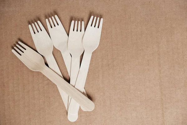 Wooden Forks Cardboard Background Eco Friendly Disposable Tableware Top View — Stock Photo, Image