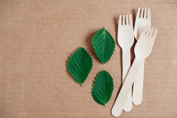 Wooden Forks Cardboard Background Eco Friendly Disposable Tableware Top View — Stock Photo, Image